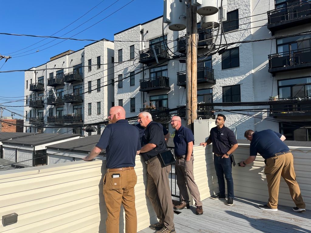 home inspectors inspecting a house terrace