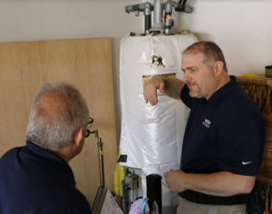 A WIN trainer teaches a new inspector what to look for in a client’s home.
