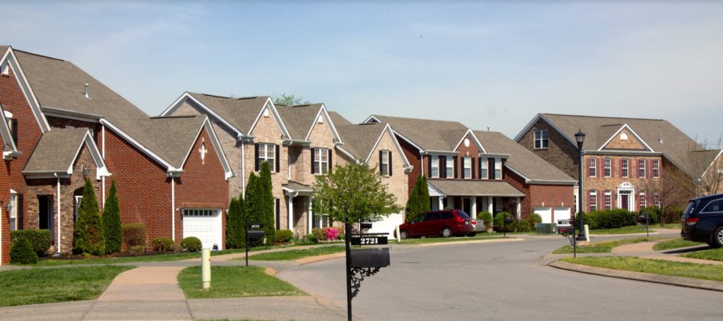 A row of homes on a quiet suburban street.