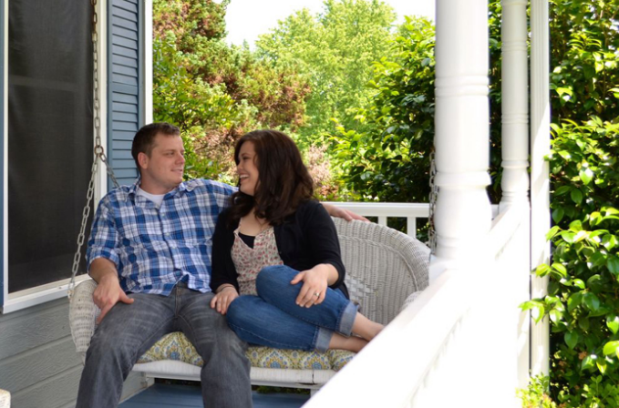 James and Jessica Price on front porch swing