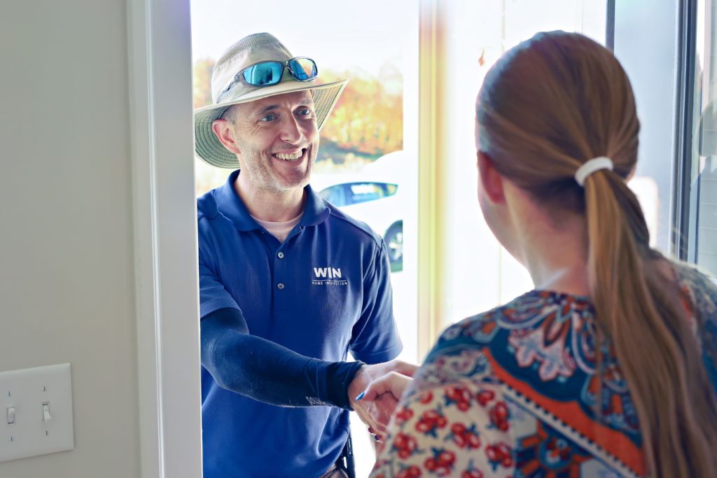 WIN Home Inspection Franchise owner shaking hand with client