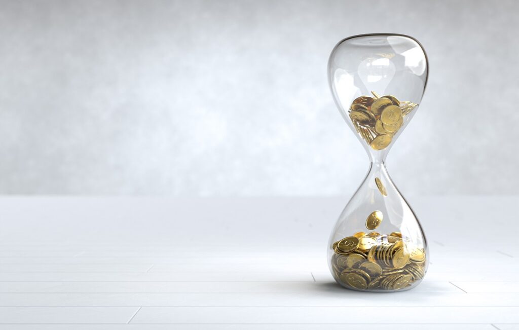 Gold coin in the hourglass