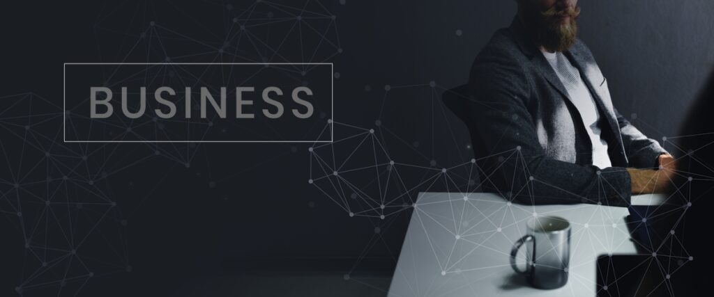 Casual businessman sitting in the dark