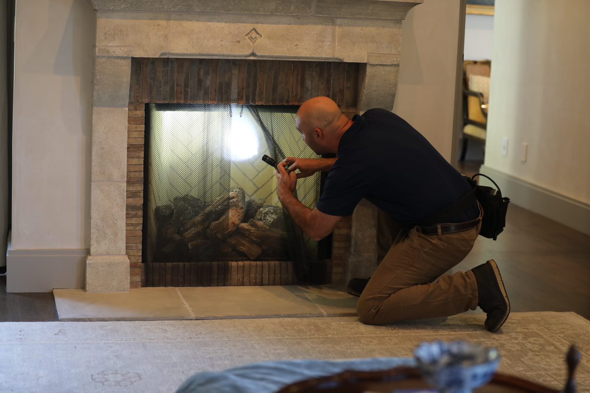 home inspector checking the fireplace