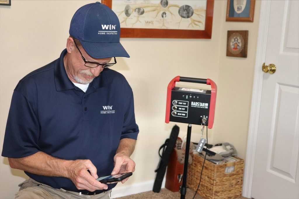 WIN Home Inspector Joe with Radon Testing Equipment