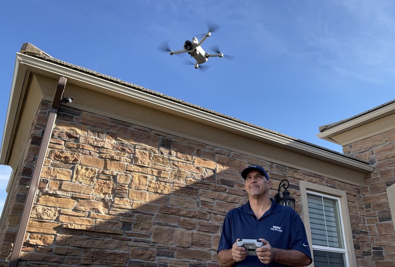 Home inspector doing a drone inspection