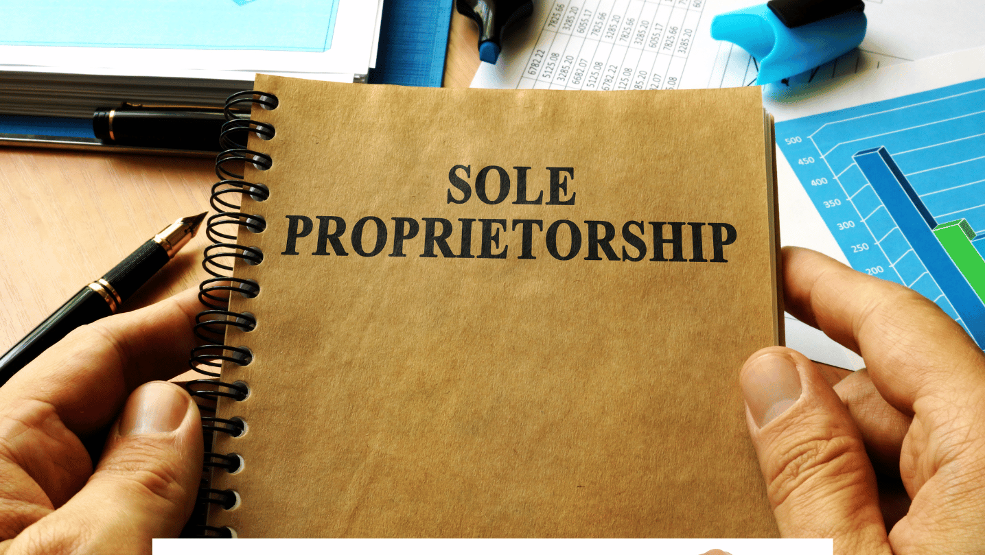 Hands holding book with title Sole proprietorship