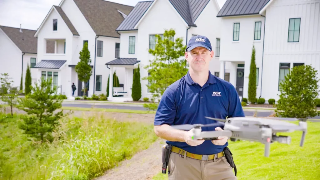 Home Inspector Flying Drone Home Inspector flying a drone with focus
