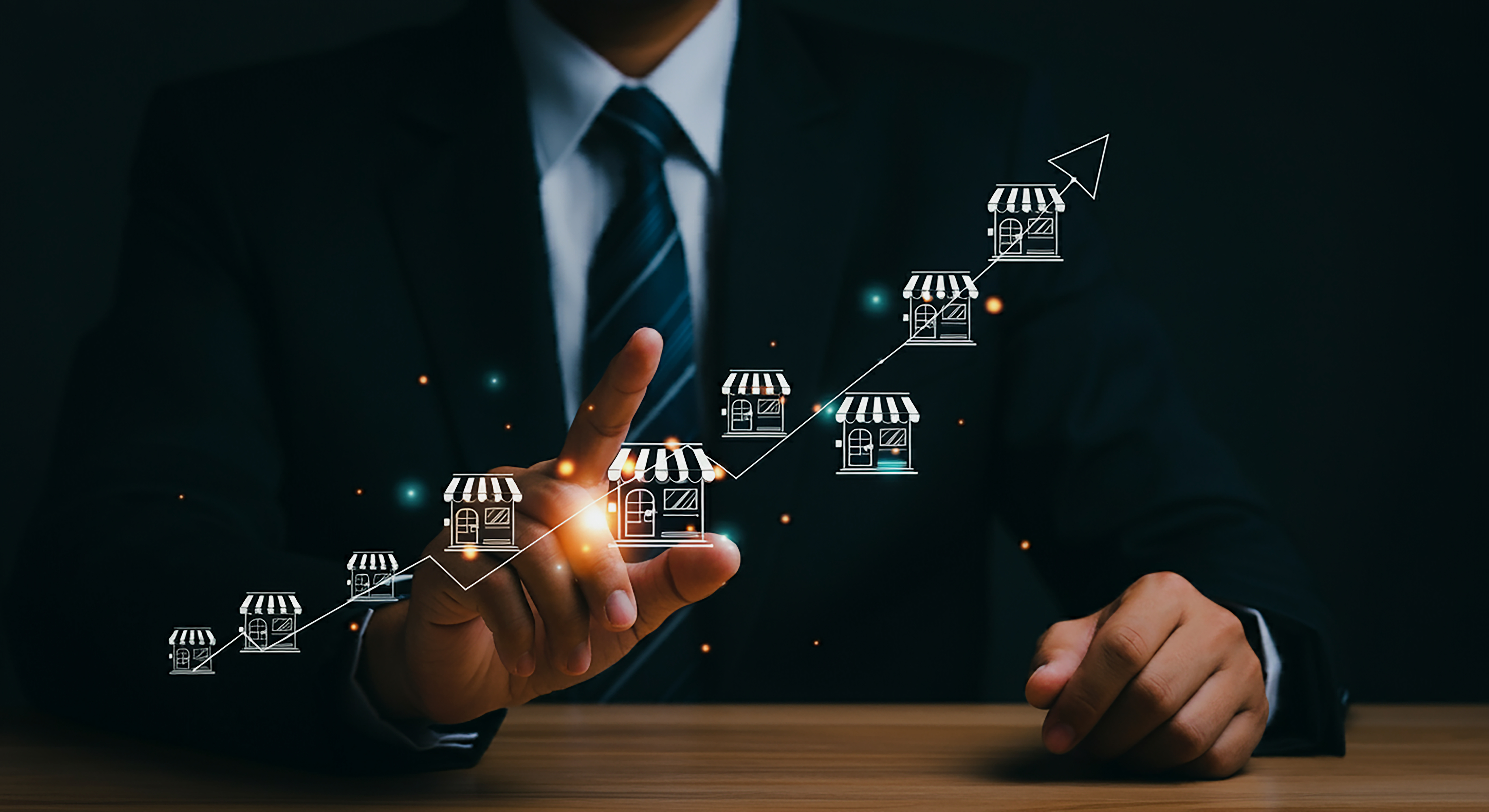Visualization of Franchise Business Growth and Expansion Strategies. An entrepreneur using a digital upward trend graph to visualize the franchise growth trajectory with growing store.