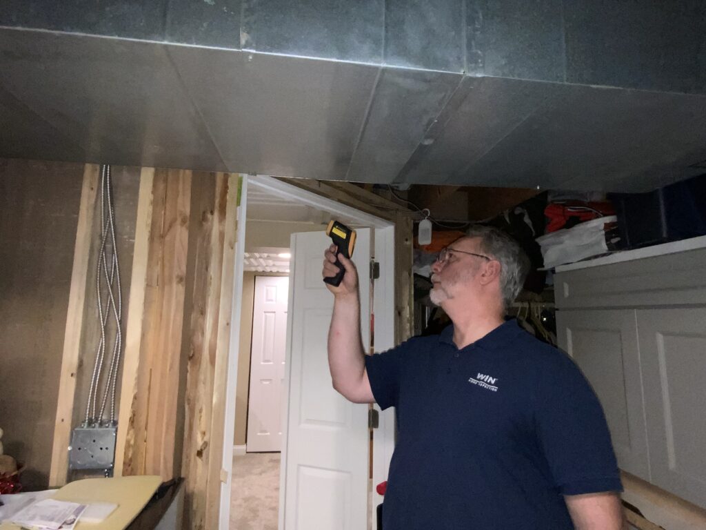 home inspector doing a infrared test