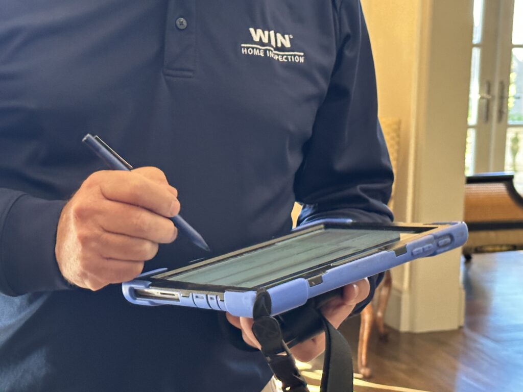 home inspector working on a tablet